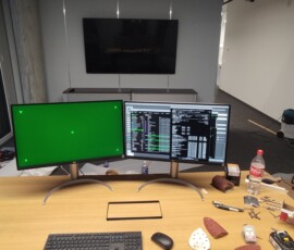 Green screen on one screen, random "cool tech stuff" on the other